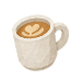 A latte in a small, white coffee mug